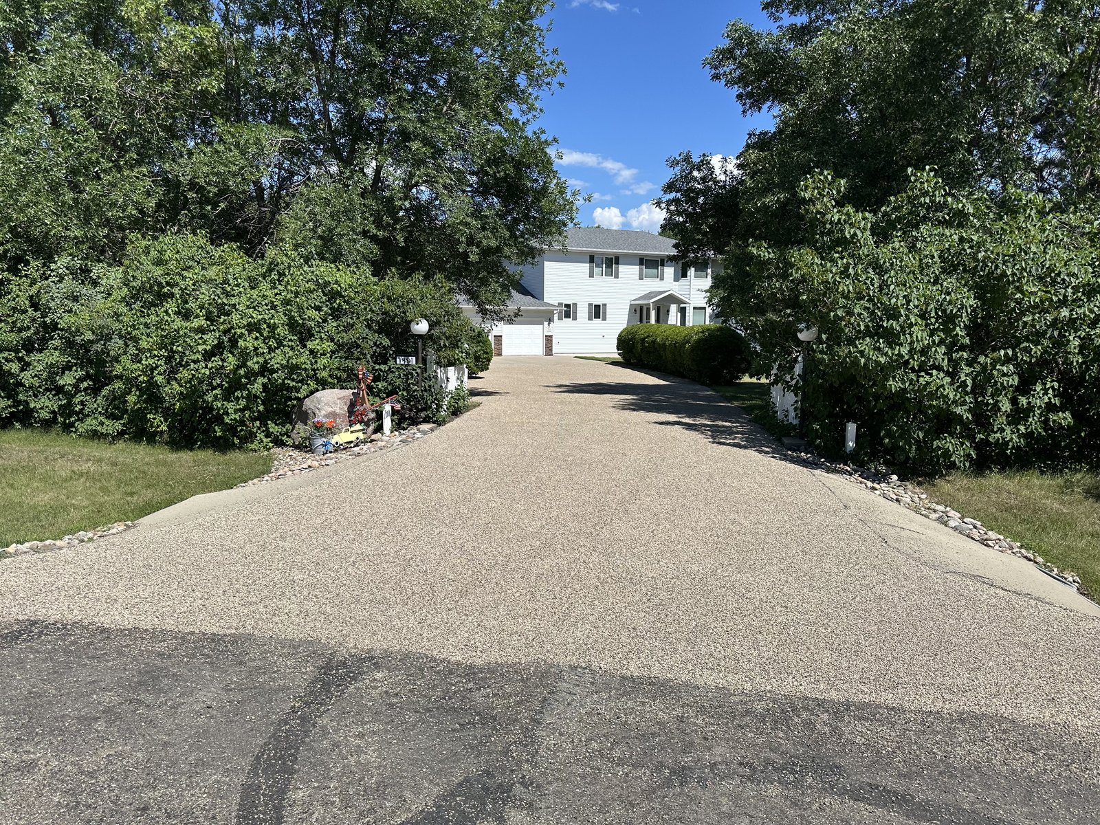 Residential driveway before paving — gravel surface