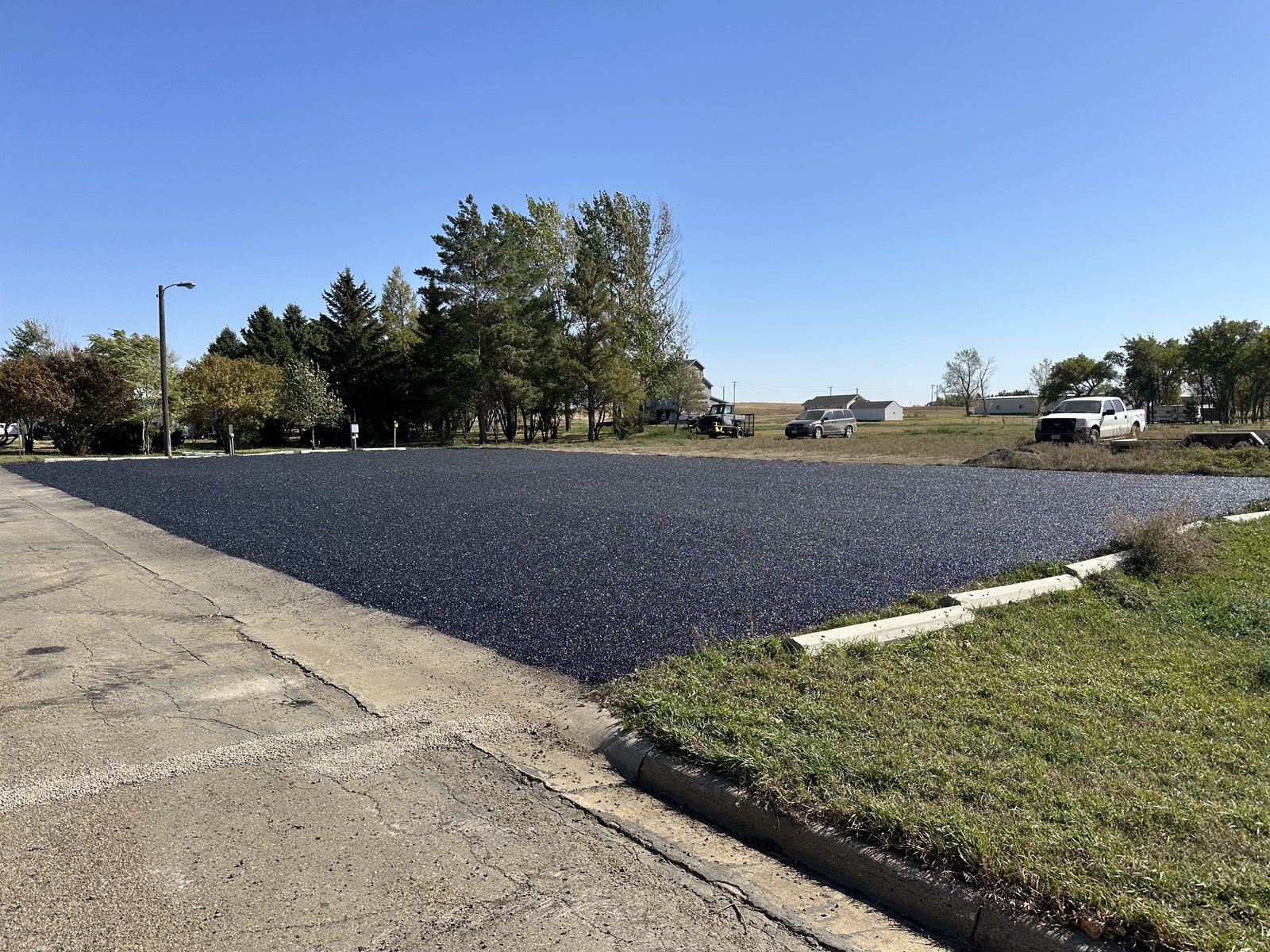 Commercial parking lot after fresh asphalt paving